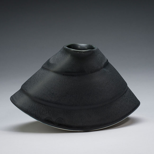 hand-thrown porcelain clay vessels with white mat glaze